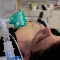 Woman in hospital on respirator