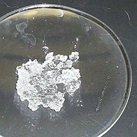 Glass dish containing crystals