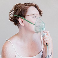 Woman using nebulizer, which can be used for Hydrogen Peroxide